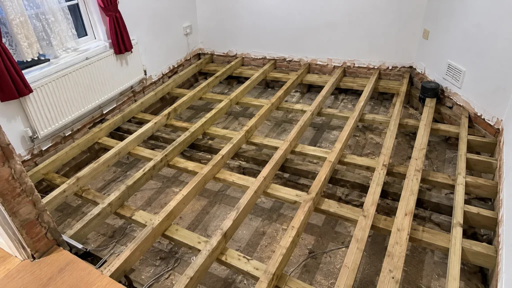 Exposed timber floor joists during carpentry renovation work
